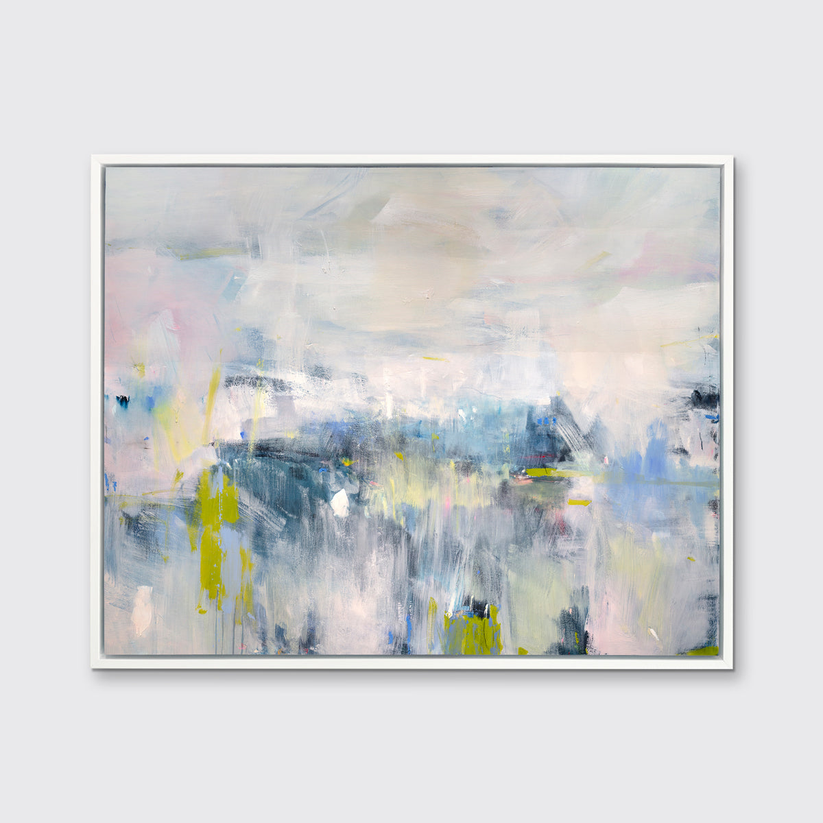 A blue and pink abstract print in a white floater frame hangs on a white wall.