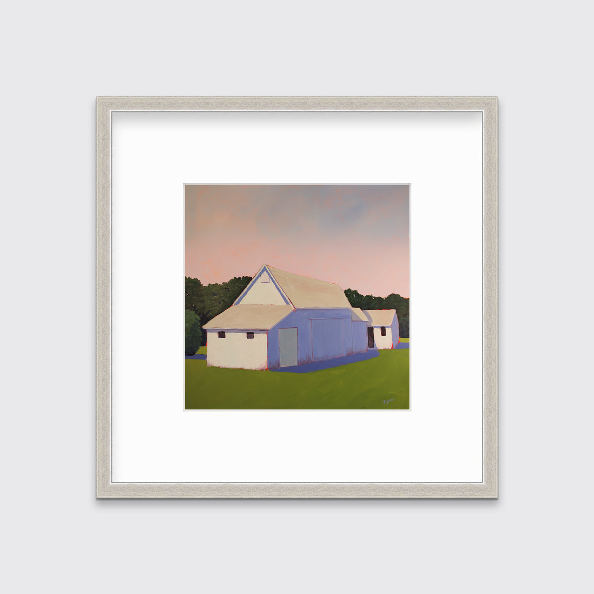 A light pink, lavender and green contemporary barn print in a silver frame with a mat hangs on a white wall.