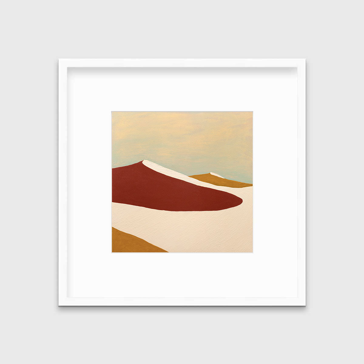 A red, burnt orange and beige abstract print in a white frame with a mat hangs on a white wall.