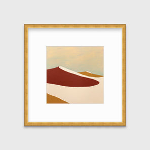 A red, burnt orange and beige abstract print in a gold frame with a mat hangs on a white wall.