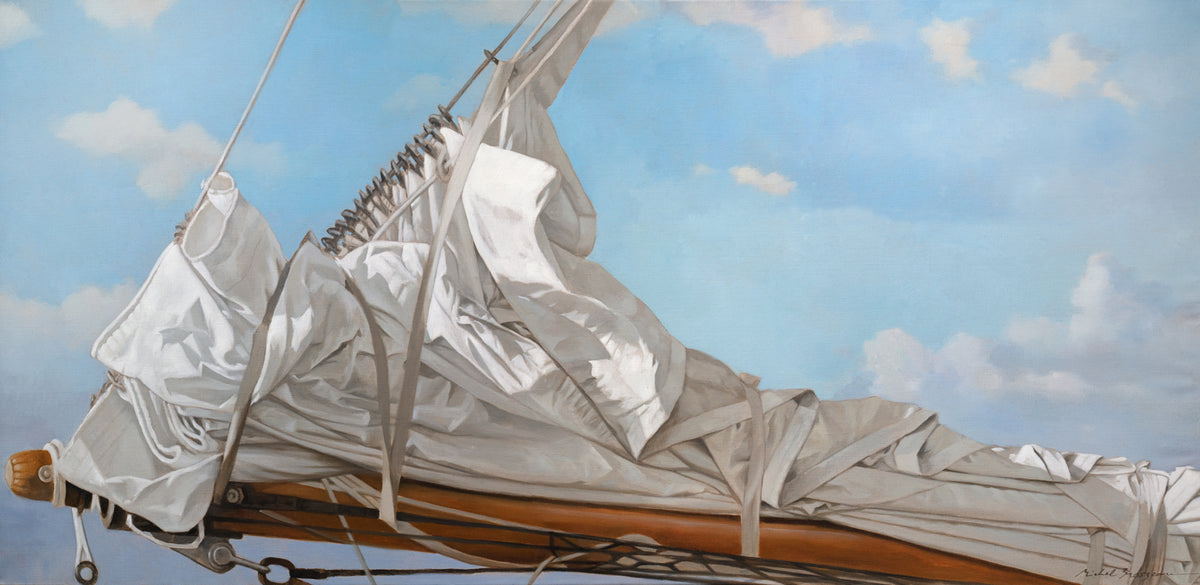 A nautical print of a white sail that has been put down on the bow of a boat against a blue sky with white clouds by Michel Brosseau.
