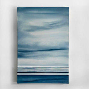 A blue and grey, abstract geometric painting hanging on a white wall.
