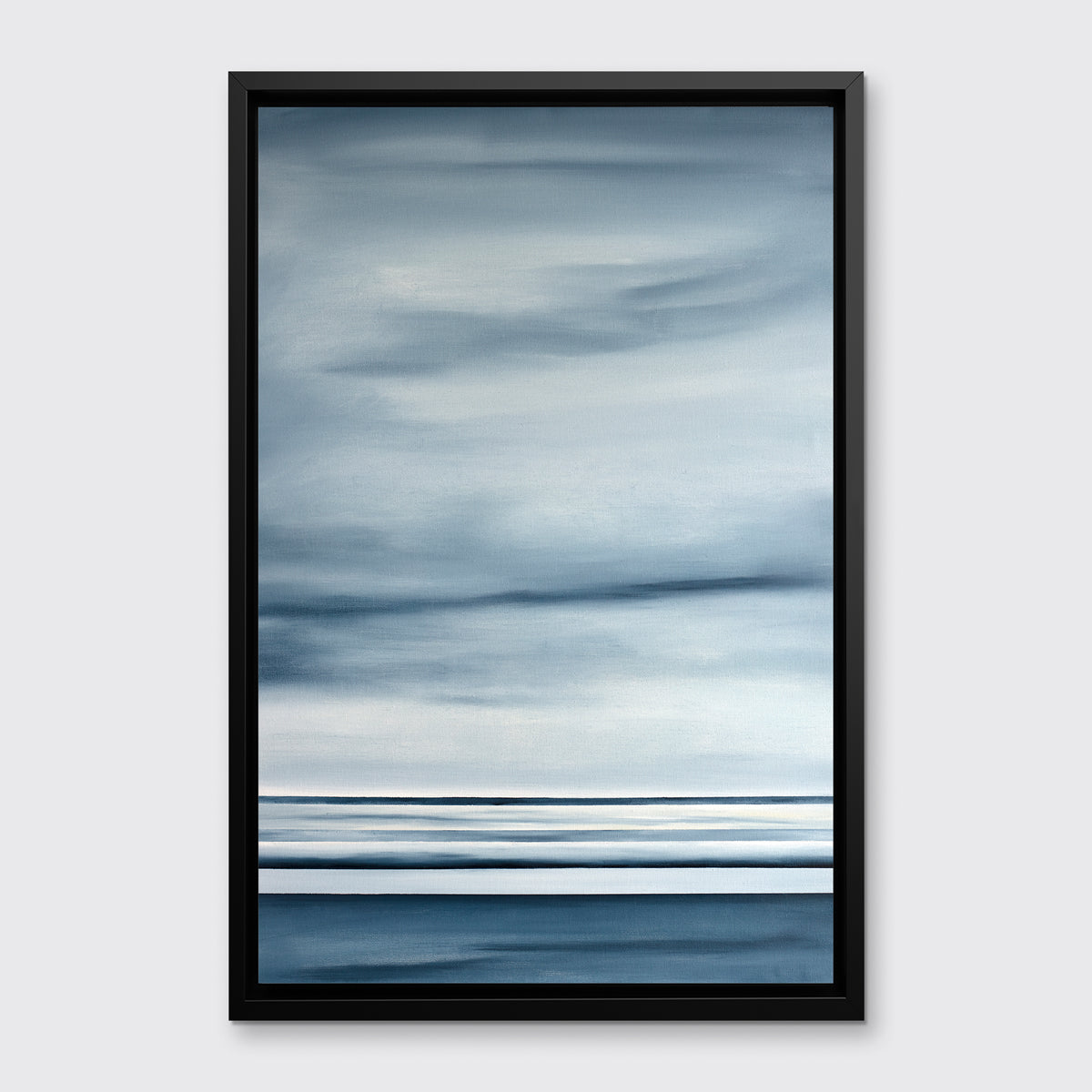 A blue and white linear abstract print in a black floater frame on a white wall.