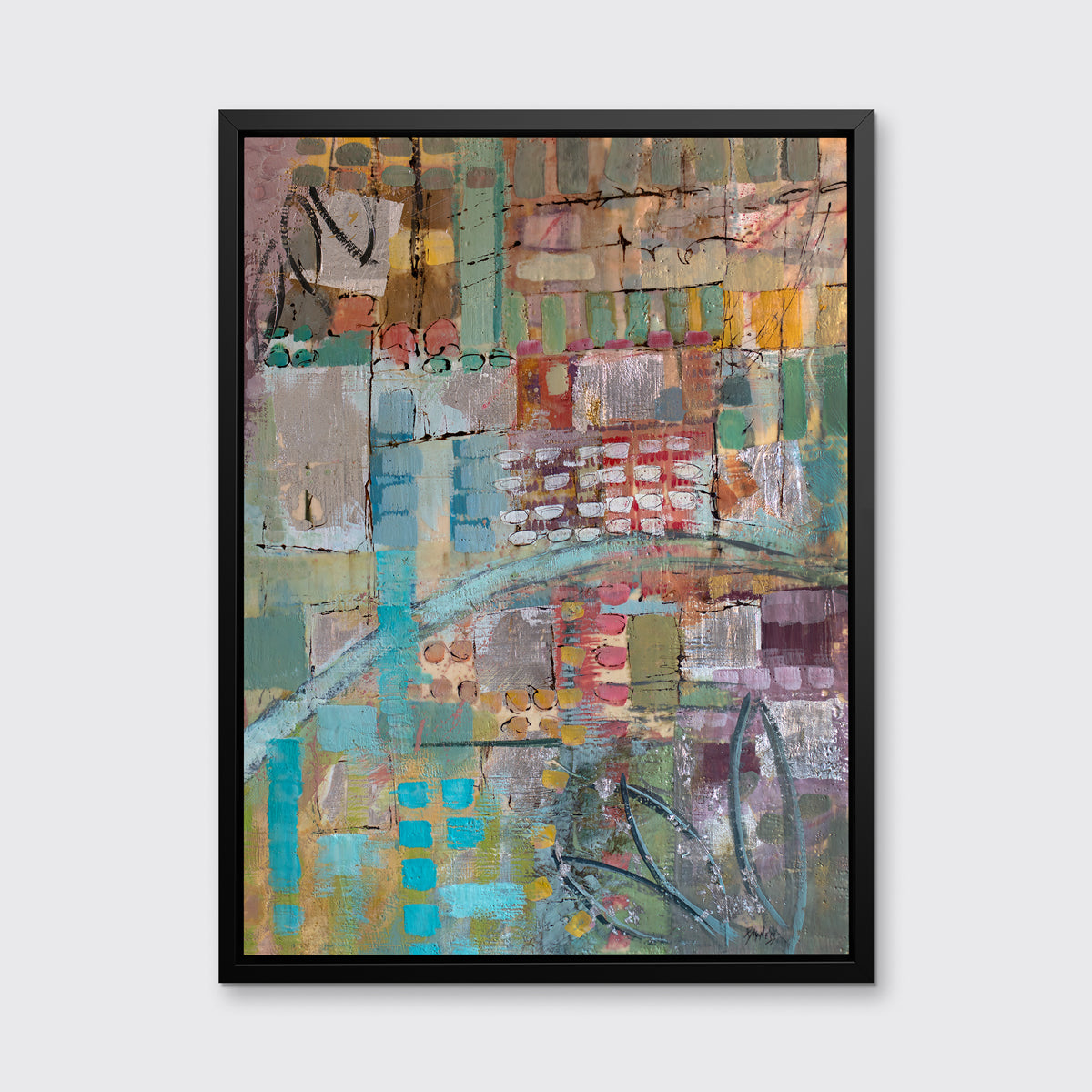 An abstract print, with green, blue, and yellow geometric and organic shapes, framed in a black floater frame on a grey wall.
