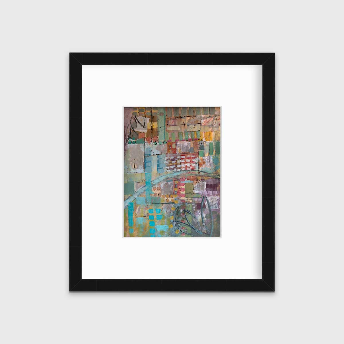 A multicolored abstract print in a black frame with a mat hangs on a white wall.