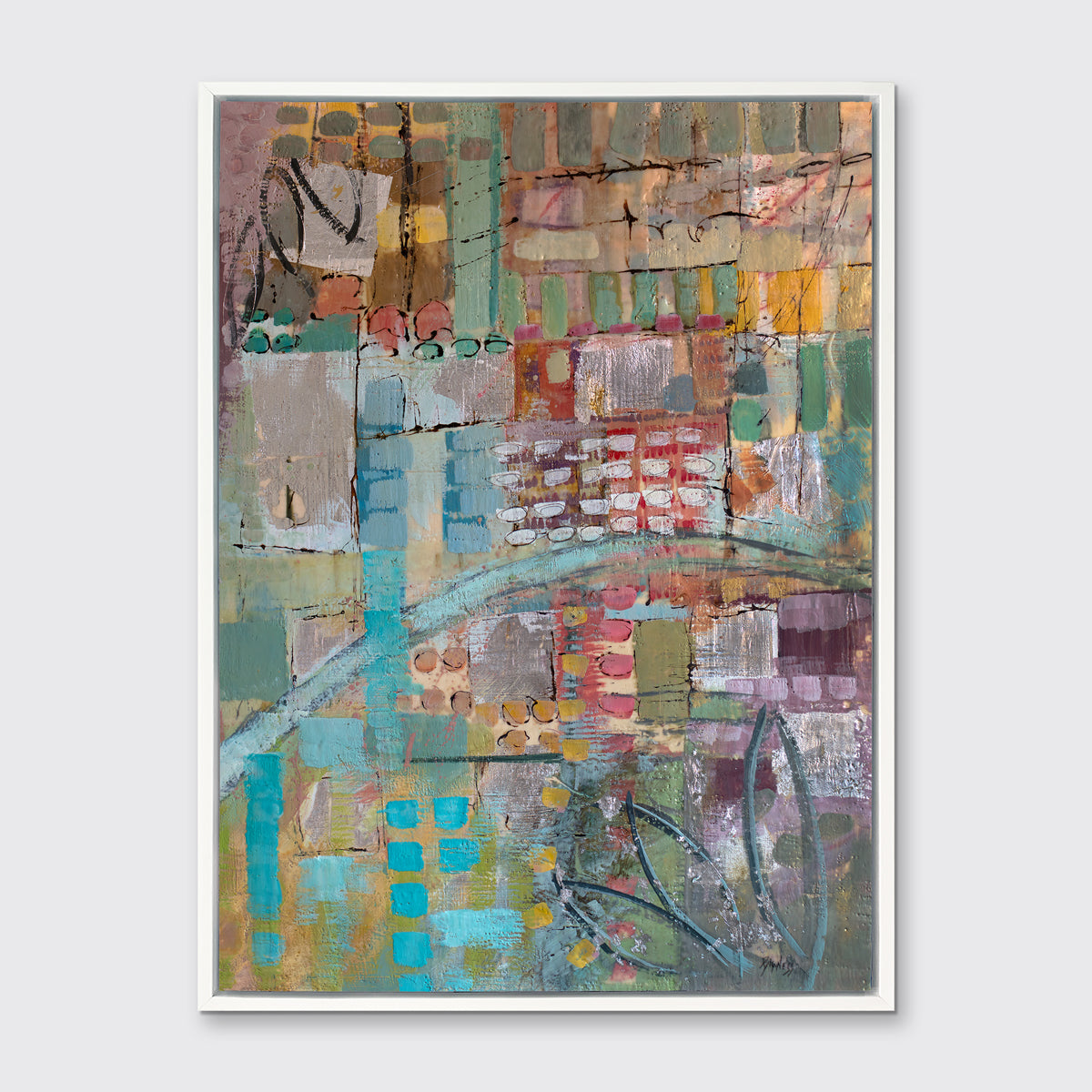 An abstract print, with green, blue, and yellow geometric and organic shapes, framed in a white floater frame on a grey wall.