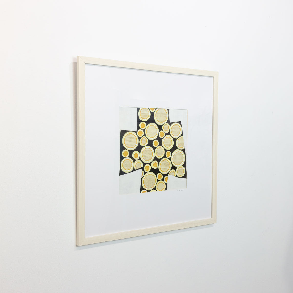 Bubbles #2 is seen at an angle on a gallery wall.