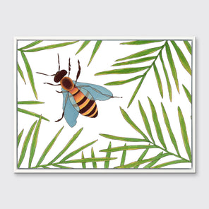 A white and green bee illustration print framed in a white floater frame hangs on a light grey wall.