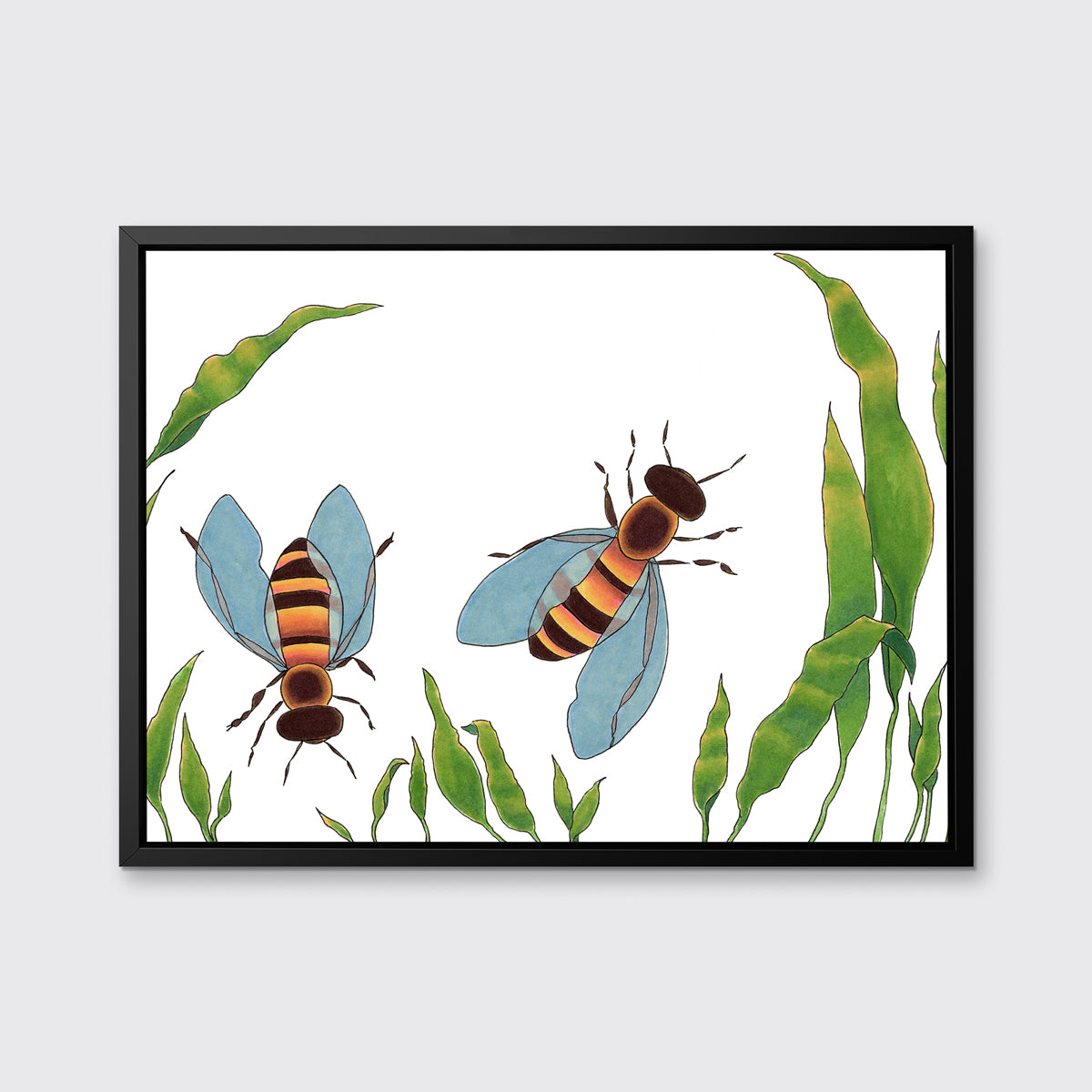 A minimalist bee illustration print framed in a black floater frame hangs on a light grey wall.