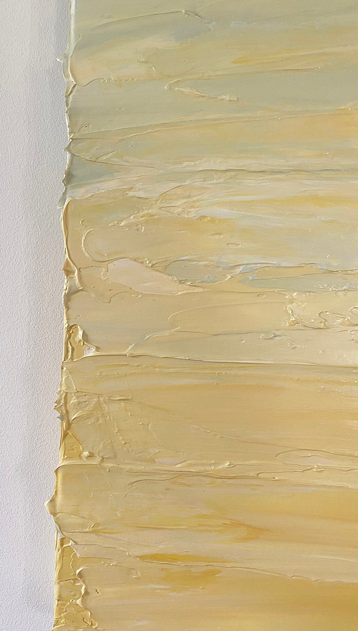 A close up of the texture of the yellow, seafoam green and white textured painting by Teo Guererra.