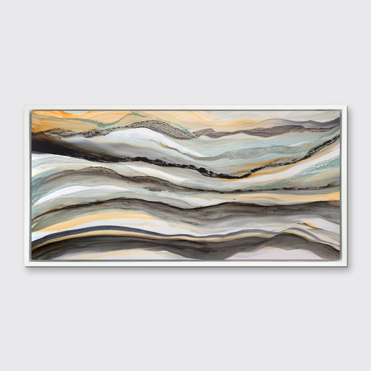 A black, white, orange and teal abstract print in a white floater frame hangs on a white wall.