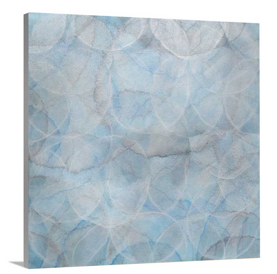 A side-angle view of a light blue abstract overlapping circle print on canvas.