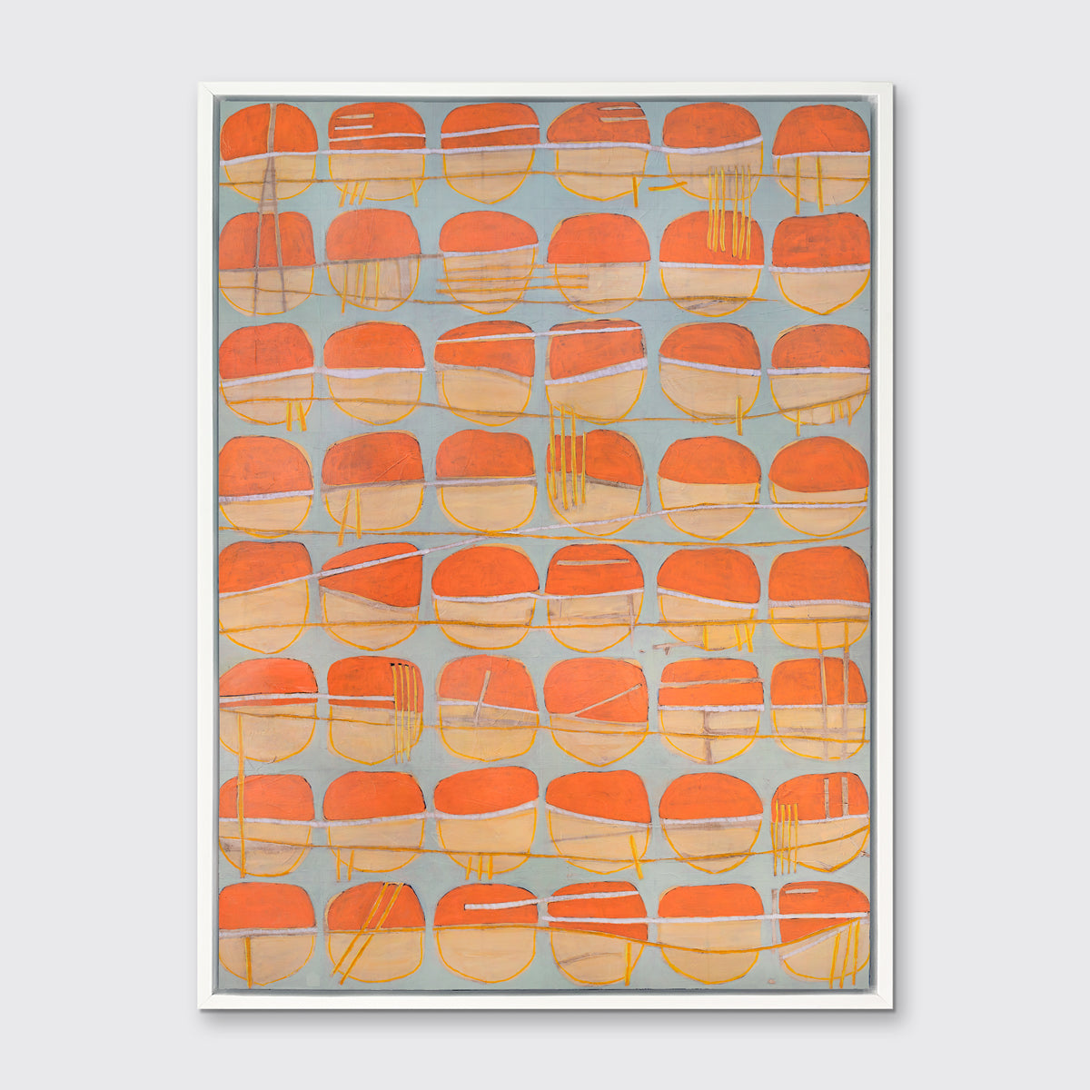 A orange, white and light blue abstract circle print in a white floater frame hangs on a white wall.