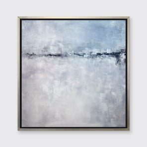 A blue and grey abstract print in a silver floater frame hangs on a white wall.