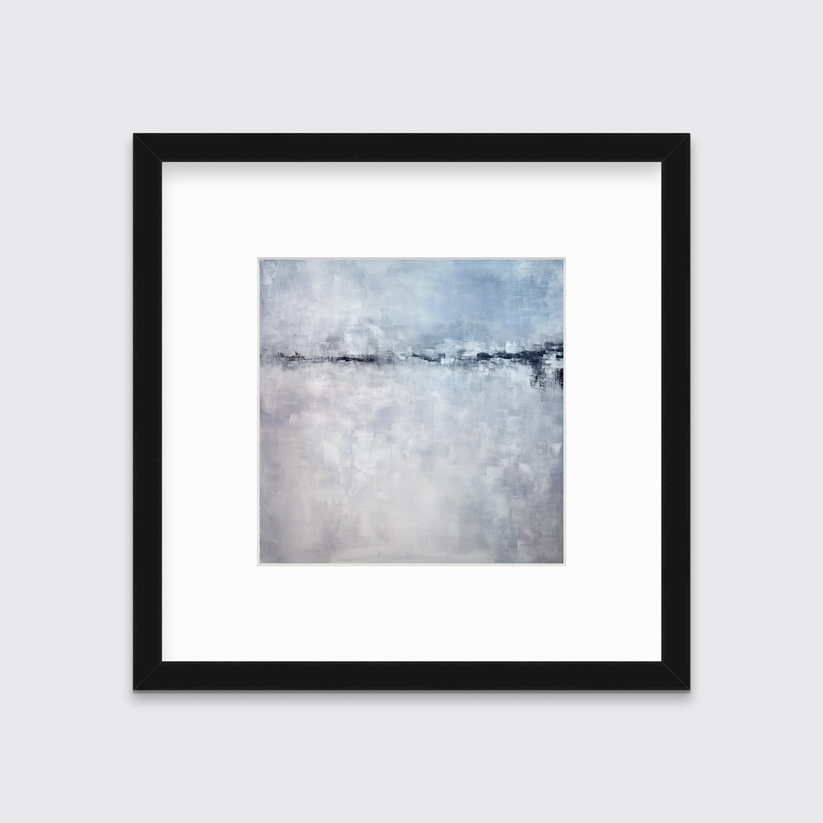 A blue and grey abstract print in a black frame with a mat hangs on a white wall.