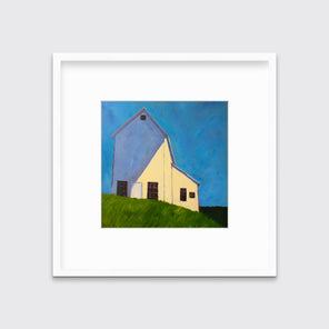 A blue, beige, lavender and green contemporary barn print in a white frame with a mat hangs on a white wall.