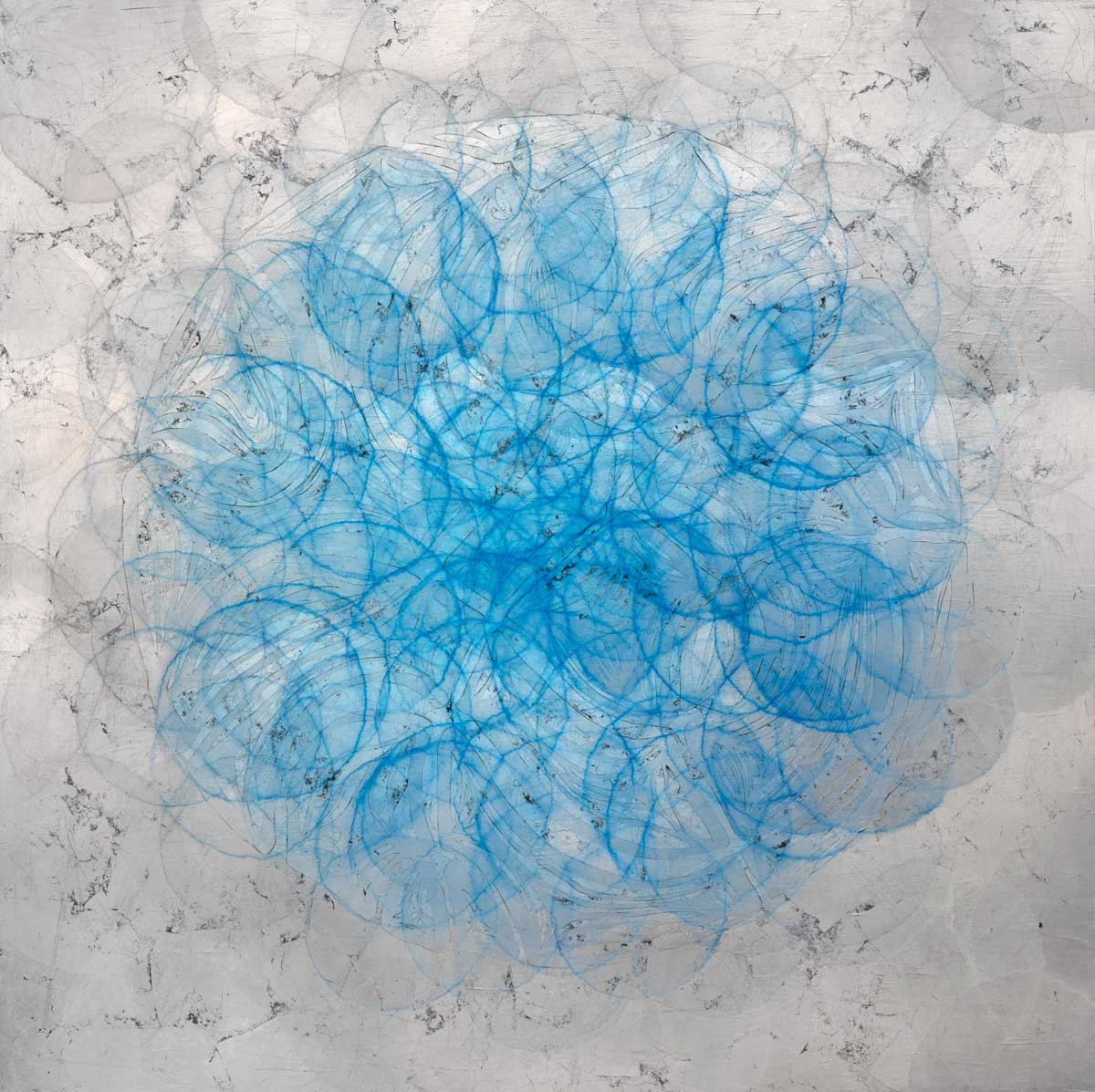 A silver and grey background of overlapping circles with blue overlapping circles in the center.