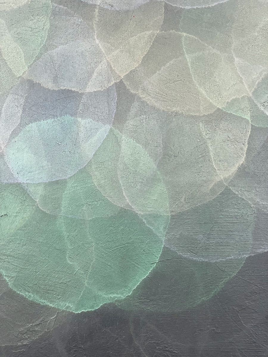 A close up detail image of the teal, white, and light lavender spheres in Roger Mudre's painting. 