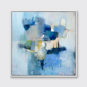 A blue abstract print in a white floater frame hangs on a white wall.
