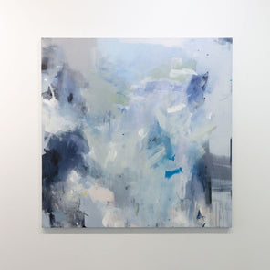 An abstract painting by Kelly Rossetti featuring blue, white and green brushstrokes is hung on a gallery wall. 