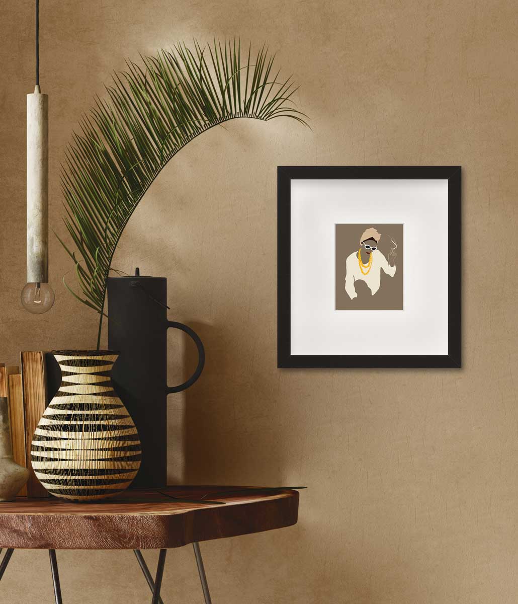 Pop art print of a woman holding a lite cigarette in a black frame with a mat hangs on a brown wall with a natural wood side table to the left holding a variety of decor and a palm leaf. 