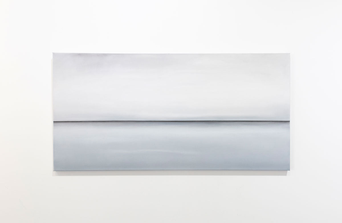 A long grey oil painting with a single black line in the middle of the canvas which suggests a horizon line is hung on a gallery wall. Wired and ready to hang.