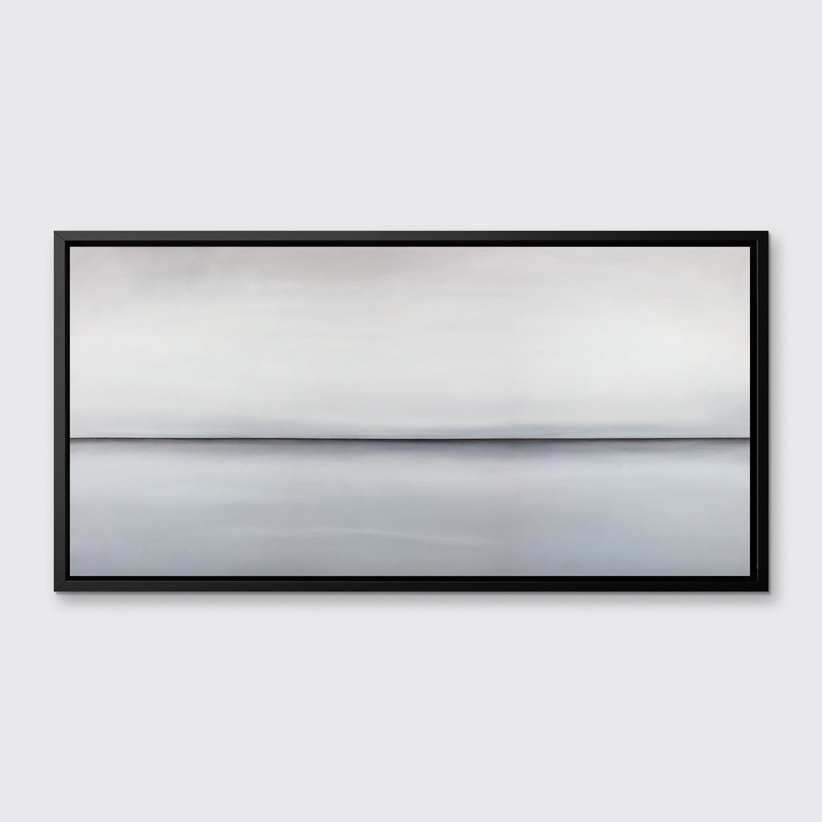 A light grey toned abstract landscape print in a black floater frame hangs on a white wall.