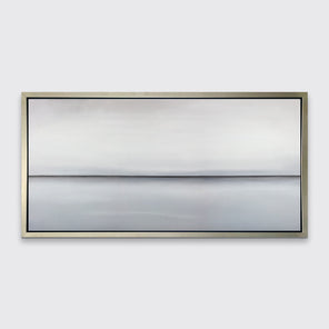 A light grey toned abstract landscape print in a silver floater frame hangs on a white wall.