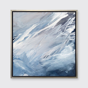A blue, grey, white and charcoal abstract print in a silver floater frame hangs on a white wall.