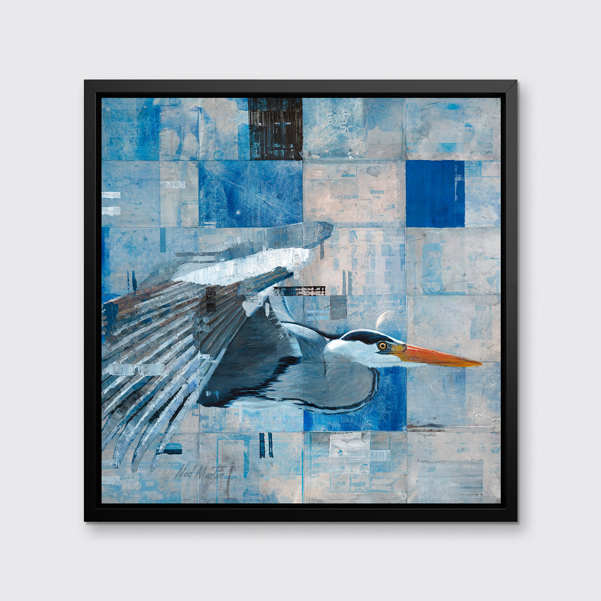 A blue abstract print of a blue heron in flight in a black floater frame hangs on a white wall.