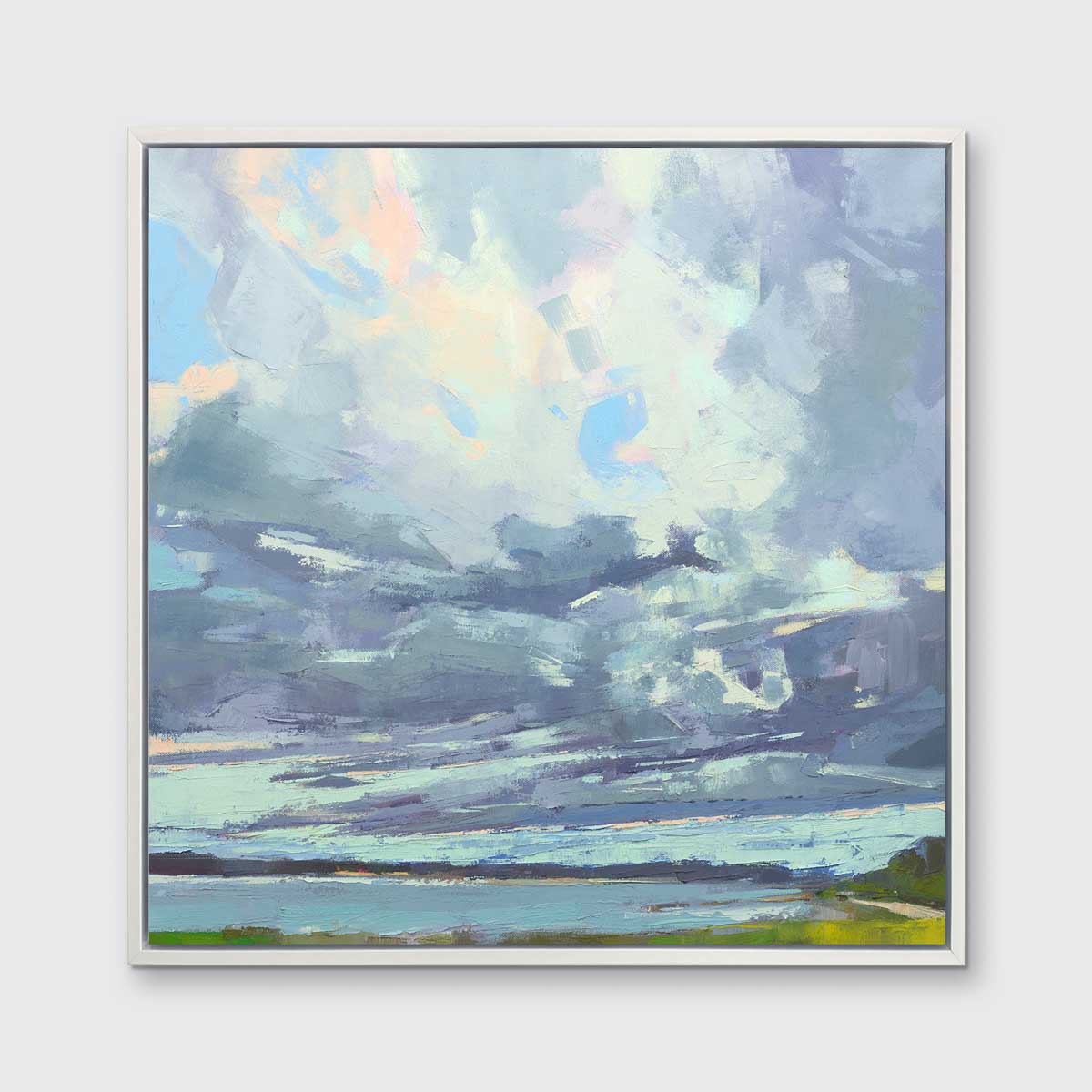 A blue, white and green abstract landscape print in a white floater frame hangs on a white wall.