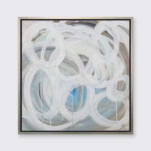 A white, light teal, blue and beige abstract print in a silver floater frame hangs on a white wall.