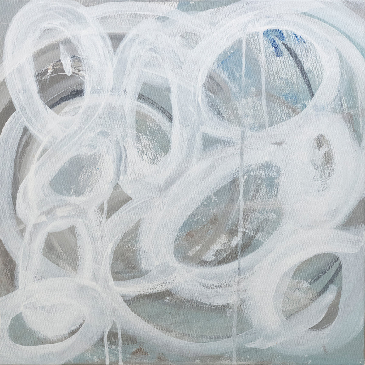 A slate grey canvas painting with white concentric circles. Wired and ready to hang.