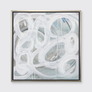 A white, light teal and grey abstract print in a silver floater frame hangs on a white wall.