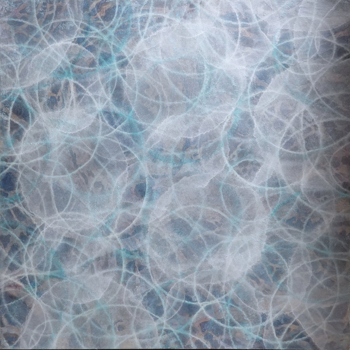 A blue, white and teal overlapping circles painting with a metallic shimmer.