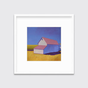 A white barn with a pink roof and yellow grass print in a white frame with a mat hangs on a white wall.