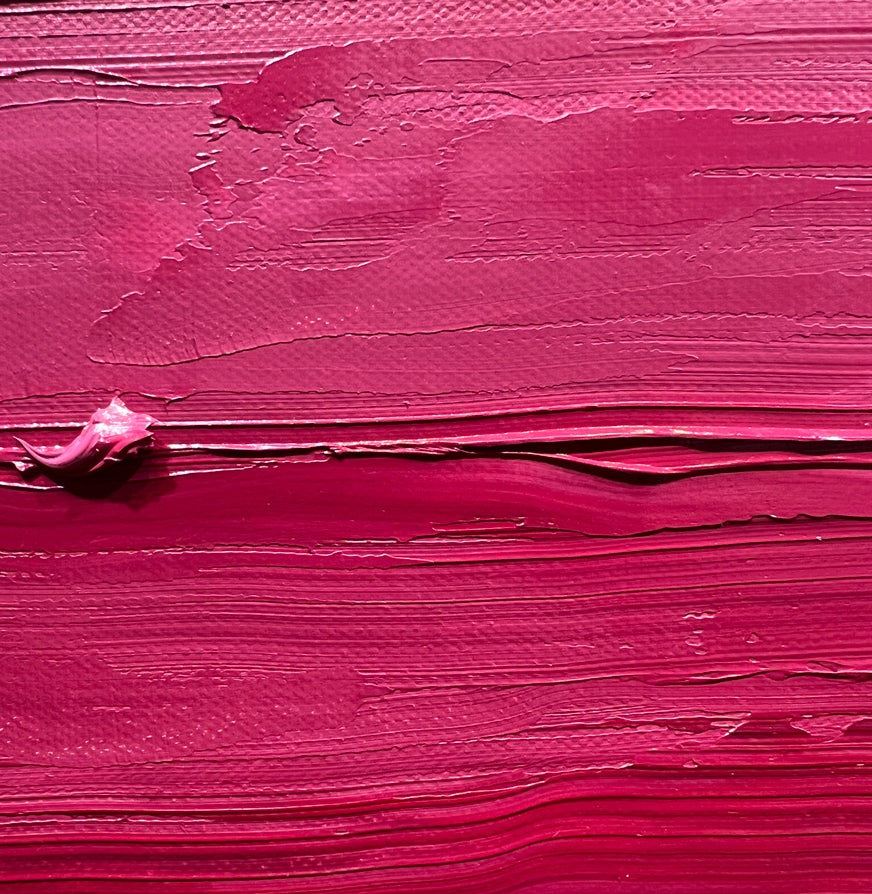 A up-close view of the pink hued texture in the painting.