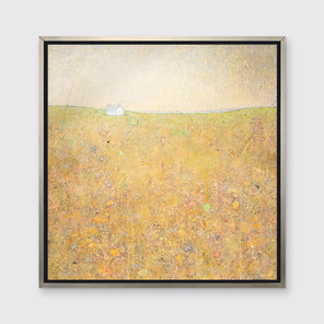 A yellow and grey abstract landscape by Elwood Howell in a silver floater frame hangs on a white wall.