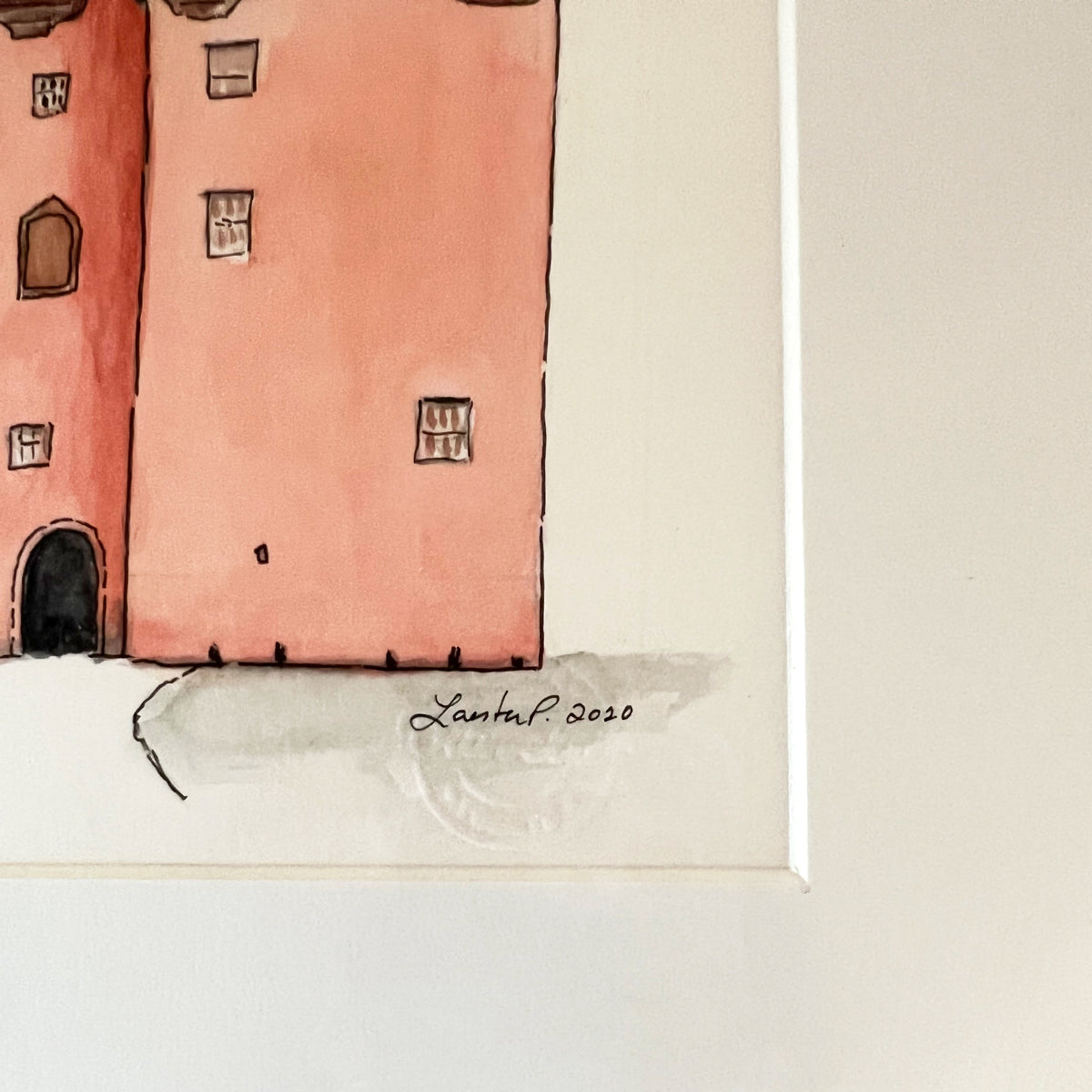 A close up view of the artist's signature and stamp.