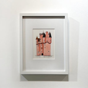 A pink, grey and brown illustration drawing of a castle in a white frame with a mat hangs on a white wall. 