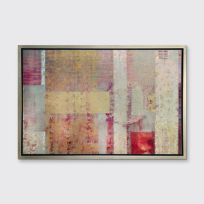 A red, yellow and grey abstract print in a silver floater frame hangs on a white wall.