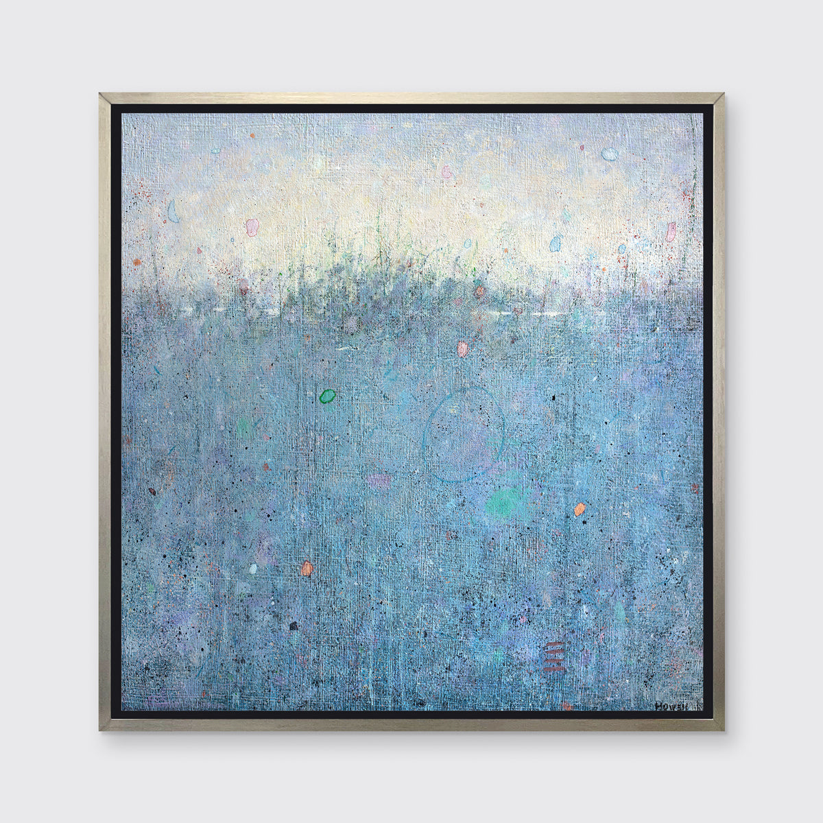 A blue abstract landscape print in a silver floater frame hangs on a white wall.