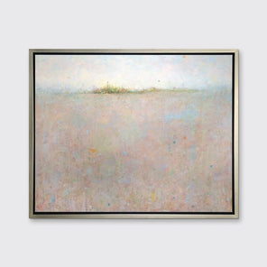 A light peach and light blue abstract landscape print in a silver floater frame hangs on a white wall.