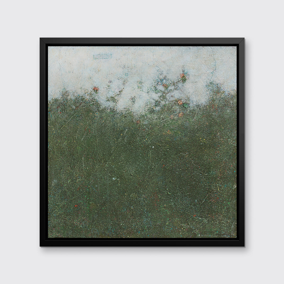 A dark green abstract landscape print in black floater frame hangs on a white wall.