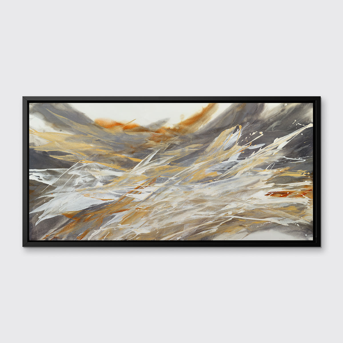 A gold, beige, white and grey abstract print in a black floater frame hangs on a white wall.