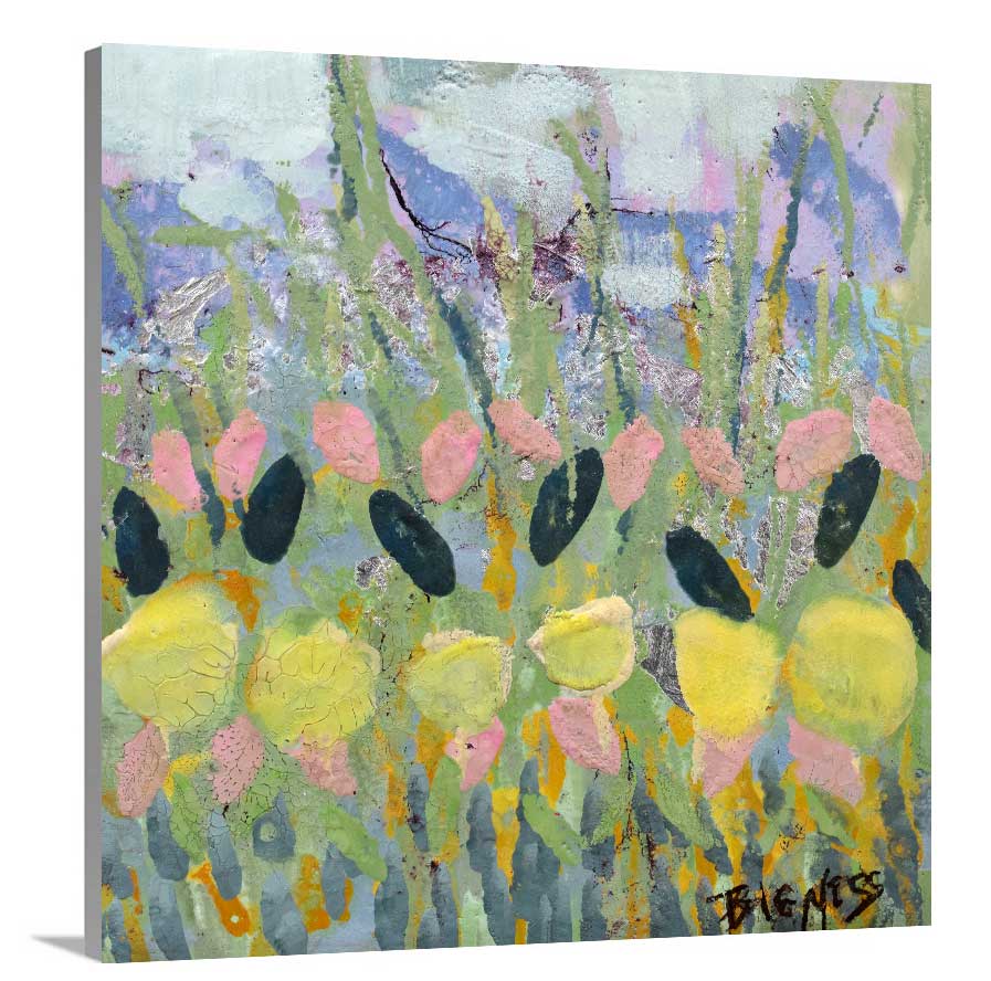 A side-angle view of a green, yellow and pink abstract floral print on canvas.