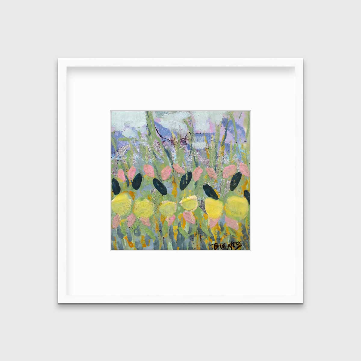A green, yellow and pink abstract floral print in a white frame with a mat hangs on a white wall.