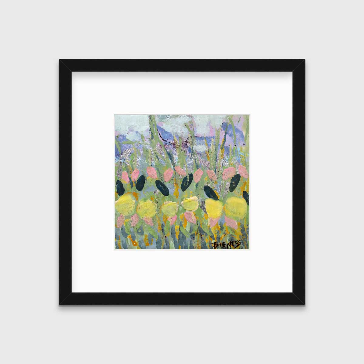 A green, yellow and pink abstract floral print in a black frame with a mat hangs on a white wall.