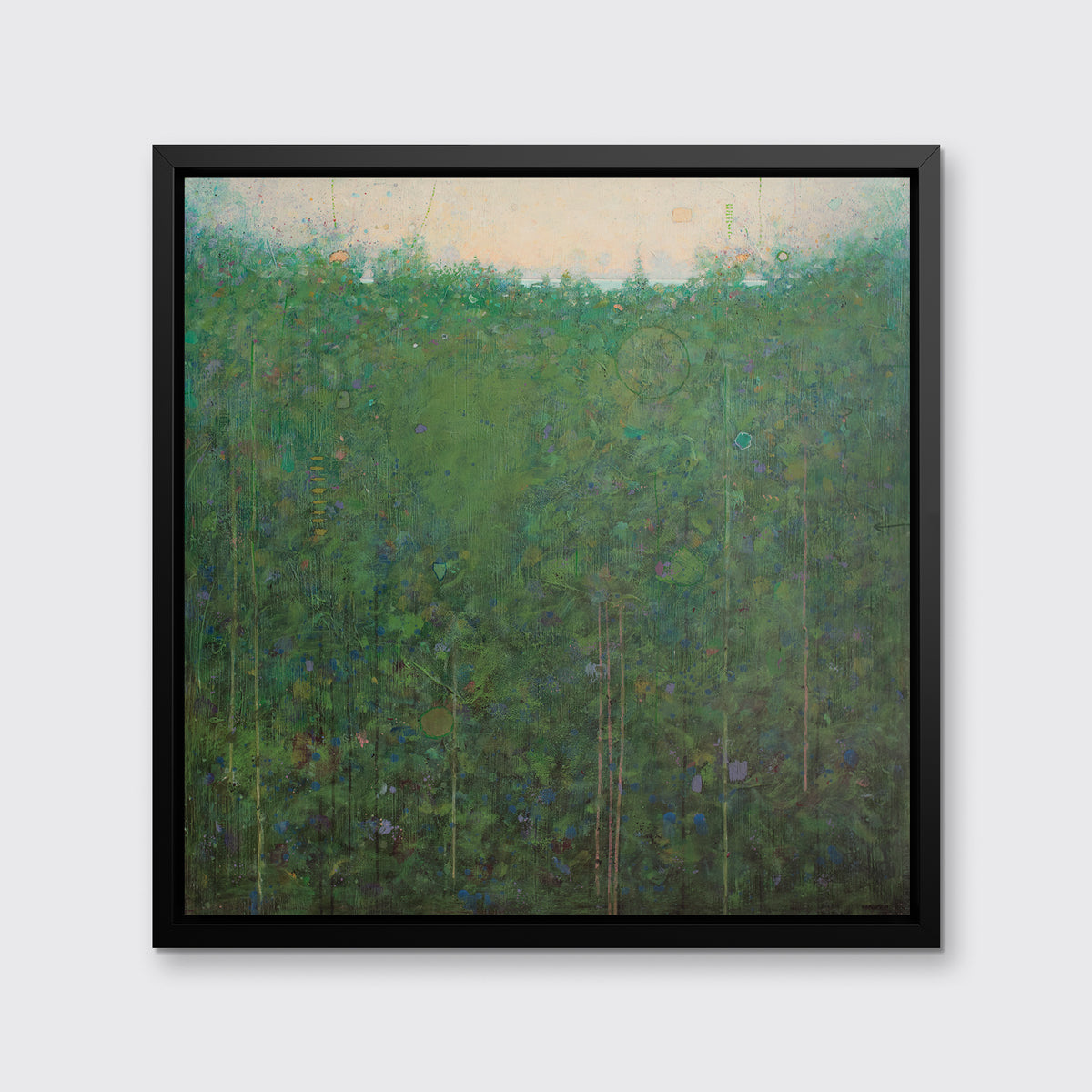 A green abstract landscape print in a black floater frame hangs on a white wall.