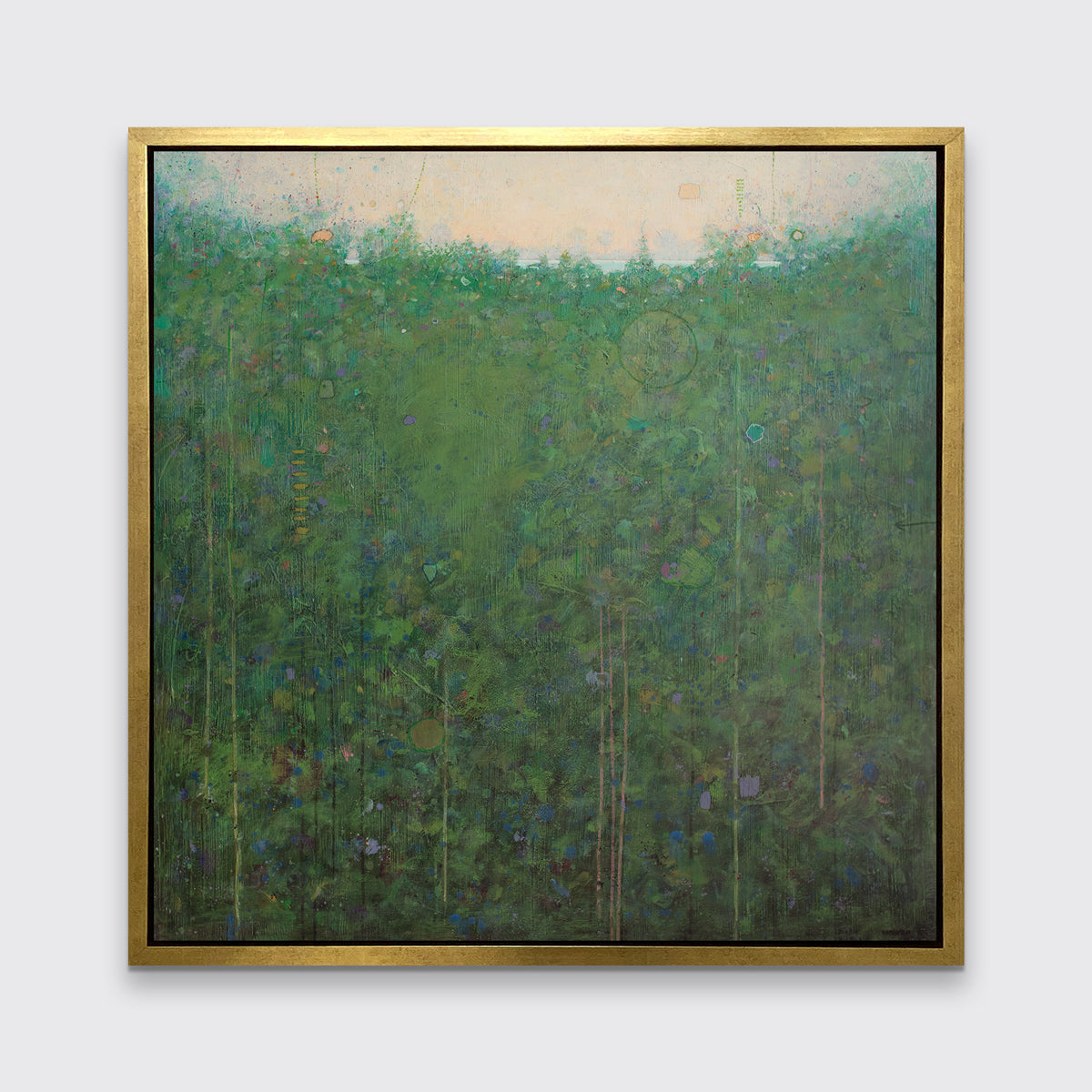 A green abstract landscape print in a gold floater frame hangs on a white wall.